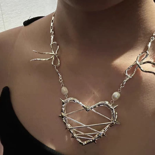 Thorn Wrapped Ribbon Pearl Pendant Necklace